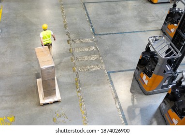Moving pack boxes using pallet truck in warehouse
