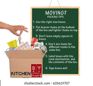 Moving Packing Tips ( Use Right Size, Label, Tape, Don't Mix Items, Leave Empty Space, Put Heavy Items On Bottom) Hand Dropping Keys Into Open Moving Box Labels Kitchen Fragile