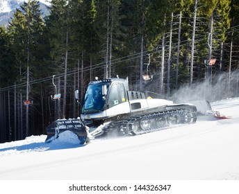 Moving Piste Basher On A Ski Slope