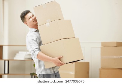 Moving, portrait and man carrying boxes in new home for mortgage, property investment or rental house. Smile, pride and male person lifting pile of cardboard package for relocation in apartment. - Powered by Shutterstock