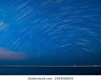 Moving stars in night sky, take photo with long exposure technique, starry night, galaxy, night sky, over the sea 