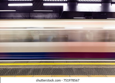 Moving Train Arriving On Platform On London Underground Tube Train Station Tunnel