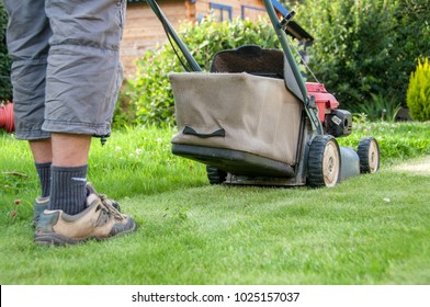 mowing the lawn in my garden - Shutterstock ID 1025157037