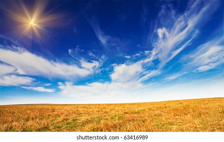 Mown Field Of Wheat And Amazing Blue Sky.