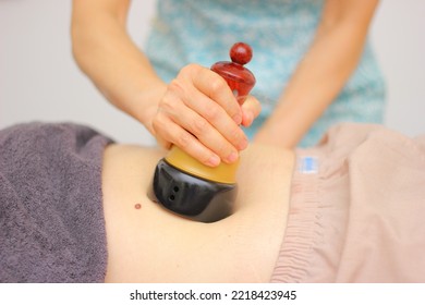 Moxibustion Massaging On The Female Stomach, Close Up