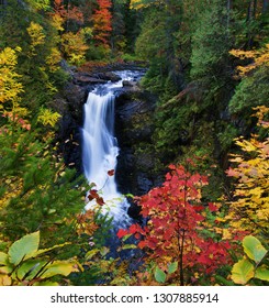 Moxie Falls in Maine USA surrounded by fall foliage - Shutterstock ID 1307885914