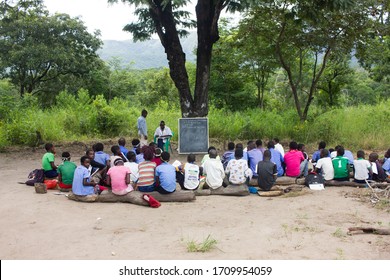 Mozambique - 21.04.2020: 
African Children Studying Outdoors Under A Tree