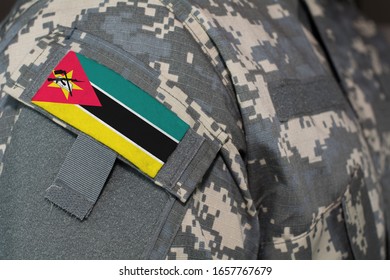 Mozambique Army Uniform Patch Flag On Soldiers Arm. Military Concept.