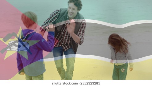 Mozambique flag image over father and daughter walking on beach. Travel, family, bonding, sunset, fatherhood, patriotism - Powered by Shutterstock