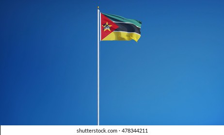 Mozambique flag waving against clean blue sky, long shot, isolated with clipping path mask alpha channel transparency