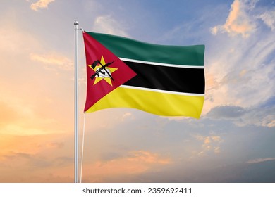 Mozambique flag waving on sundown sky