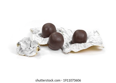 Mozartkugel Closed Up Wrapped Into Foil , Chocolate Pralines Isolated On White.