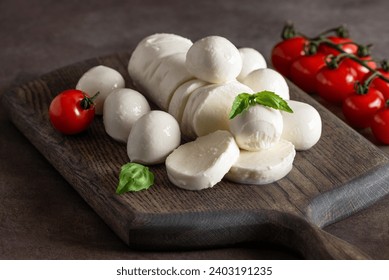 Mozzarella cheese close-up on a dark background. Side view, selective focus.