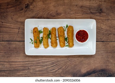 Mozzarella Cheese Sticks On A Wooden Table With Room For Copy