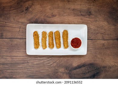 Mozzarella Cheese Sticks On A Wooden Table With Room For Copy