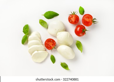 mozzarella, cherry tomatoes and fresh basil - ingredients for caprese salad
