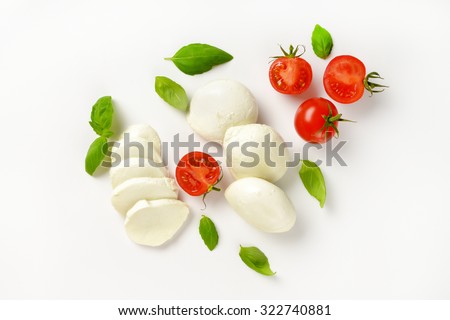 mozzarella, cherry tomatoes and fresh basil - ingredients for caprese salad