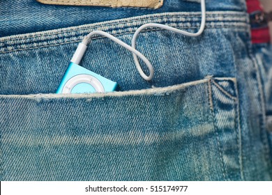 MP3 Player In Jeans Pocket With Headphones Wire