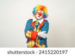 Mr Clown. Portrait of sadness face Clown man in colorful uniform standing crying feeling sad emotional. Expression male bozo in various pose on isolated background.