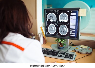 MRI Machine And Screens With Doctor And Nurse