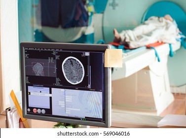 MRI Machine And Screens With Doctor And Nurse