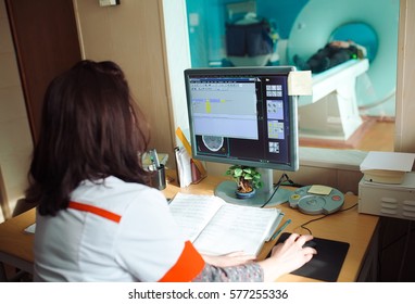 MRI Machine And Screens With Doctor And Nurse