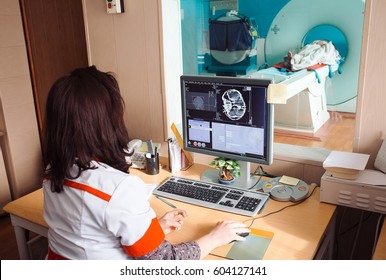 MRI Machine And Screens With Doctor And Nurse