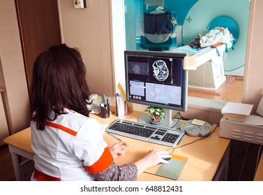 MRI Machine And Screens With Doctor And Nurse