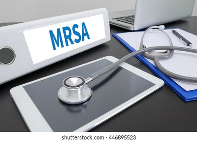 MRSA     (Methicillin-resistant Staphylococcus Aureus) Folder On Desktop On Table. Ipad