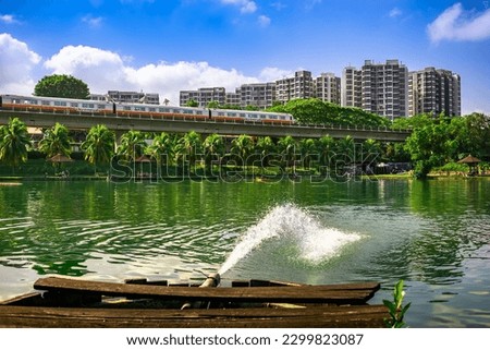MRT Train passing with The Estuary codo in the background, Yishun Town, Singpore.