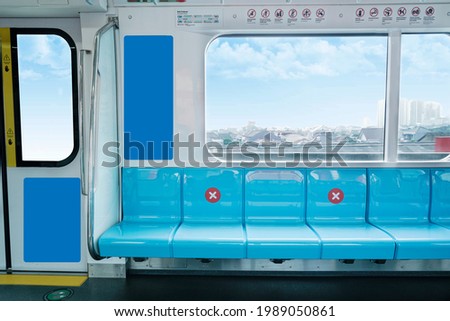 MRT transportation seats with views of people's houses