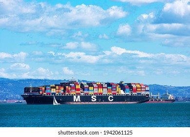 MSC Laurence container ship fully loaded with containers is anchored in San Francisco Bay waiting to dock at the Port of Oakland - Oakland, California, USA - 2021
