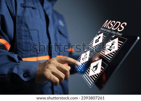MSDS material Safety data sheet concept with officer or supervisor reviewing chemical information on hazard substance in industrial plants on tablet screen to prepare for emergency or accident case