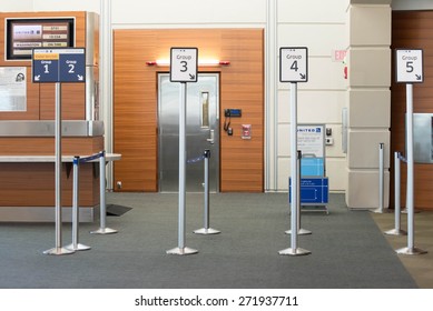 MSY, Louis Armstrong New Orleans International Airport, New Orleans, LA, USA - October 15, 2015:  Boarding Gate And Priority Lane Markers