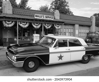 MT AIRY, NORTH CAROLINA, USA -SEPTEMBER 18, 2021 - Wally's Service Station in Mayberry, Mt. Airy, NC with Mayberry Sheriff police car replica from the award winning television Andy Griffith Show.
