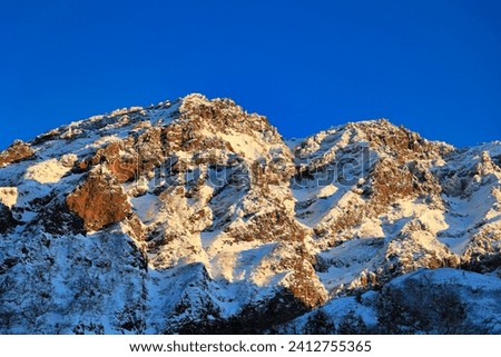 Similar – Image, Stock Photo Mountain range in deep sunset red