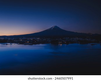 Mt. Fuji in the early morning_Snow-capped_Aerial view of Lake Kawaguchi_Drone aerial photography - Powered by Shutterstock