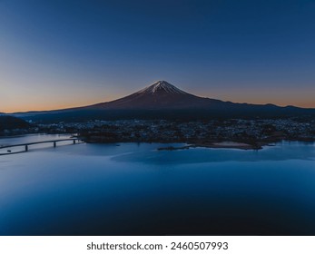 Mt. Fuji in the early morning_Snow-capped_Aerial view of Lake Kawaguchi_Drone aerial photography - Powered by Shutterstock