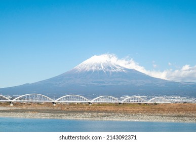 Mt. Fuji As Seen From Shizuoka With Railway And Fuji River In Front.