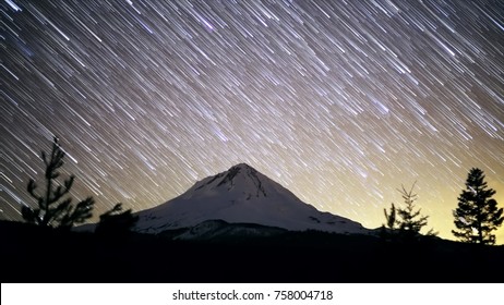 Mt. Hood And Glow Of Portland Night Sky Star Trails Over Oregon