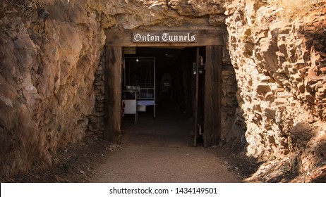 Mt Isa, Queensland, Australia - June 15th 2019: Entrance Into The War Time Underground Historical Hospital In The Australian Outback Town. Restored With Antique Furniture In A Small Cave. 