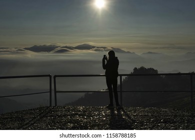 MT. KELIMUTU, INDONESIA, May 2016 Tourist Taking Photo During Sunset