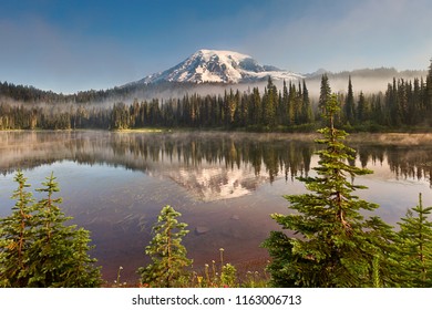 Mt Rainier and Reflection Lake with misty fog rolling through