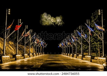 Mt Rushmore and flags after dark