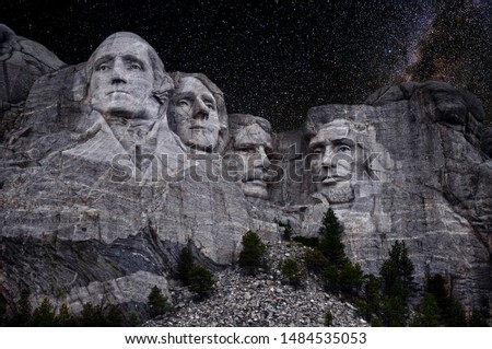 Mt. Rushmore National Memorial Park in South Dakota with stars and milky way background. Sculptures of former U.S. presidents; George Washington,Thomas Jefferson,Theodore Roosevelt and Abraham Lincoln