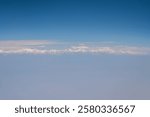 Mt.Everest with others Himalayas mountains range look through airplane window during flight from Bangkok to Kathmandu, Nepal.