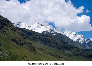 Mt.Hanuman tibba, friendship peak and seven sister peaks seen enroute Rohtang Pass,Manali in Himachal pradesh. Amazing view of snow covered high altitude mountain peaks. Blue sky with clouds landscape