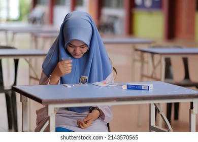 Muadzam Shah, Malaysia - April 7th, 2022 : Lateral-Flow-Test Covid Rapid Home-use Test Kit For Saliva - Step 2 - Spit With Mouth Through Funnel In Plastic Tube To Collect Sample.