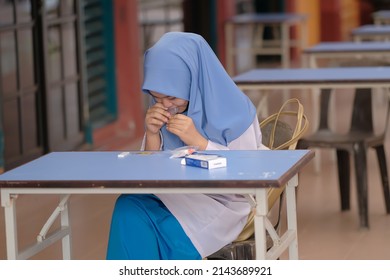 Muadzam Shah, Malaysia - April 7th, 2022 : Lateral-Flow-Test Covid Rapid Home-use Test Kit For Saliva - Step 2 - Spit With Mouth Through Funnel In Plastic Tube To Collect Sample.