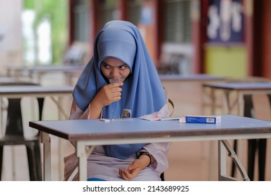 Muadzam Shah, Malaysia - April 7th, 2022 : Lateral-Flow-Test Covid Rapid Home-use Test Kit For Saliva - Step 2 - Spit With Mouth Through Funnel In Plastic Tube To Collect Sample.